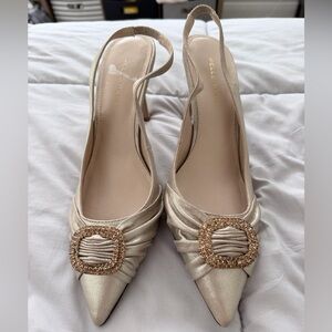 Pelle Moda Champagne Gold Slingback Pointed Toe Pumps with Crystal Buckles